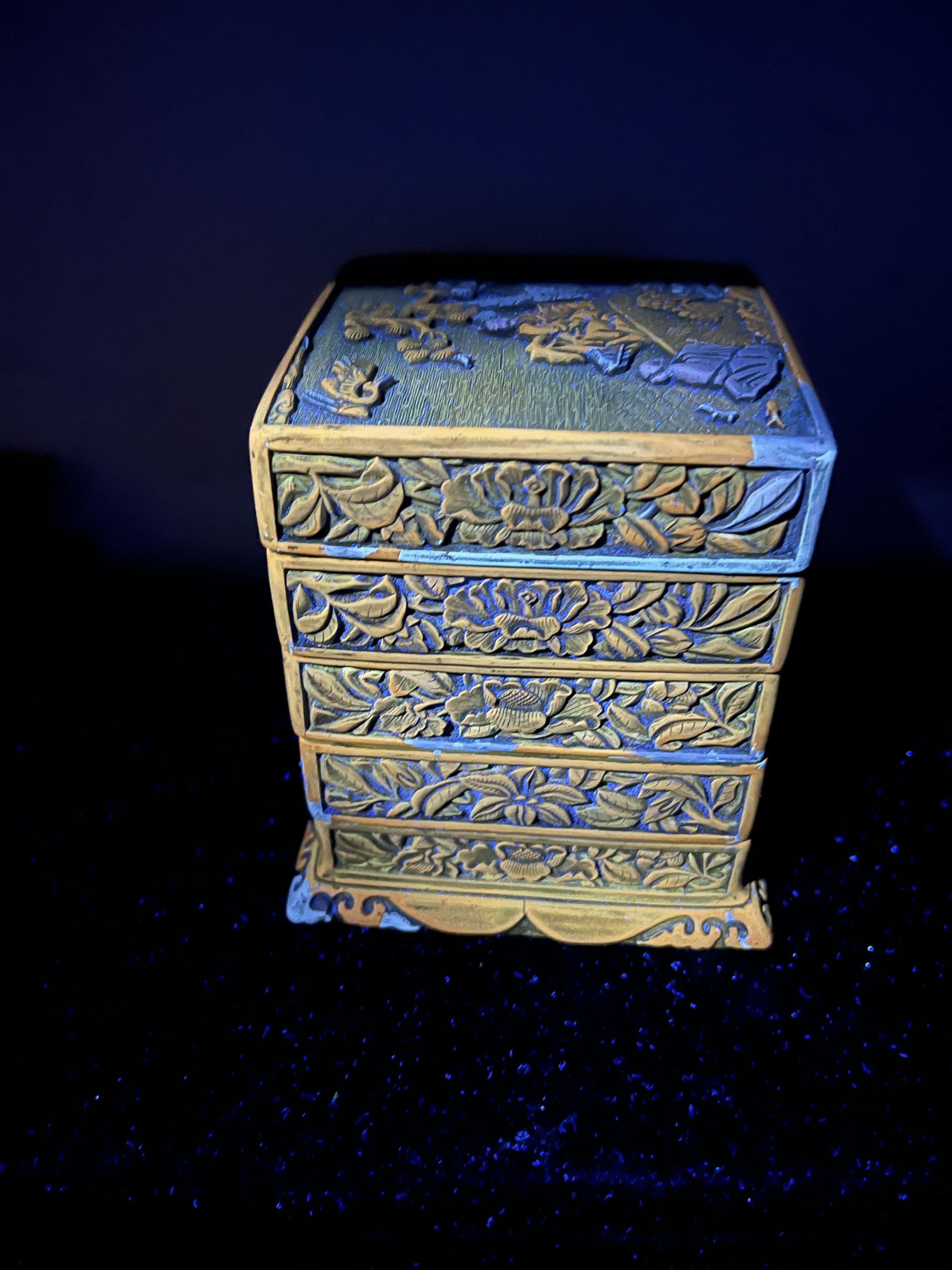 A Chinese Ming cinnabar lacquer four tier box, 15th century